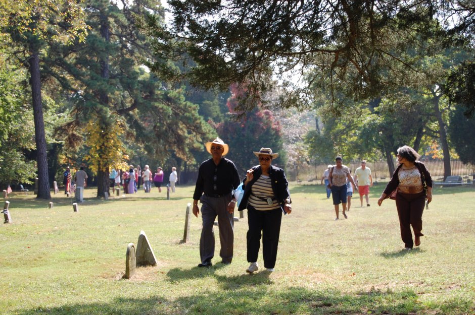 Visitors walk through Jacobs cemetery on Oct. 5 as the historic site shares its story with the community.  